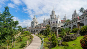 Simala Shrine exterior in Sibonga Cebu with castle-like facade and landscaped grounds