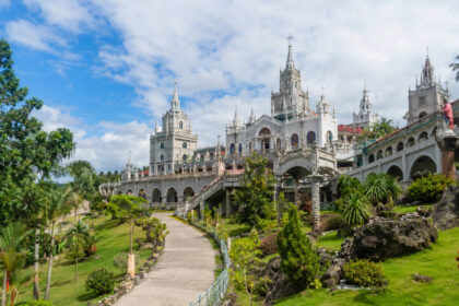 Simala Shrine exterior in Sibonga Cebu with castle-like facade and landscaped grounds
