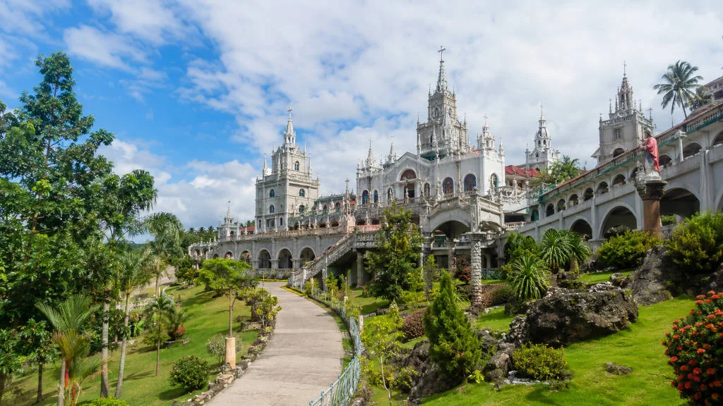 Simala Shrine exterior in Sibonga Cebu with castle-like facade and landscaped grounds