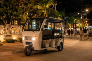 Solo travel Boracay e-trike transport option at night