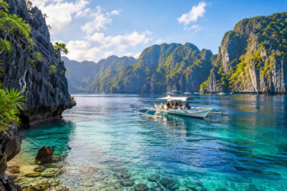 Limestone cliffs and calm blue water for a things to do in El Nido guide