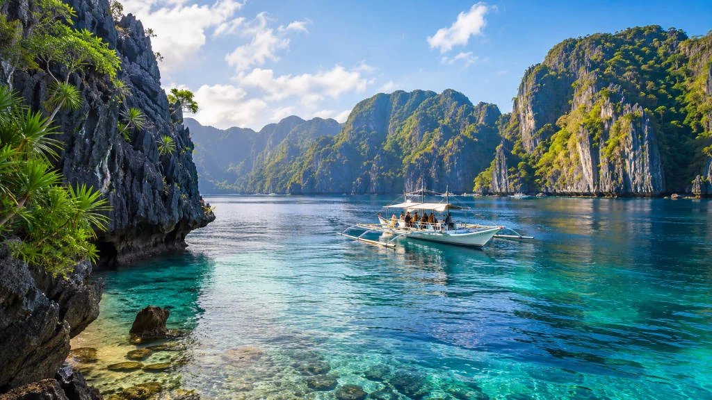 Limestone cliffs and calm blue water for a things to do in El Nido guide