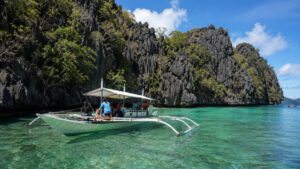 Boat near Twin Lagoon in Coron for a twin lagoon entrance fee guide