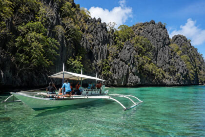 Twin Lagoon Entrance Fee and Costs: What to Budget For Boat near Twin Lagoon in Coron for a twin lagoon entrance fee guide