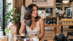 Traveler smiling during a relaxed Bacolod travel budget food trip
