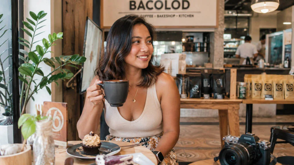 Traveler smiling during a relaxed Bacolod travel budget food trip