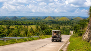 Bohol countryside travel budget planning with Chocolate Hills road view