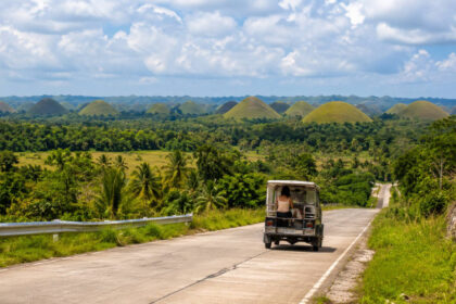 Bohol Countryside Travel Budget: Sample Daily Costs for Budget and Comfort Trips Bohol countryside travel budget planning with Chocolate Hills road view