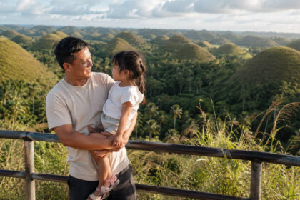 Family enjoying Bohol countryside with kids near Chocolate Hills