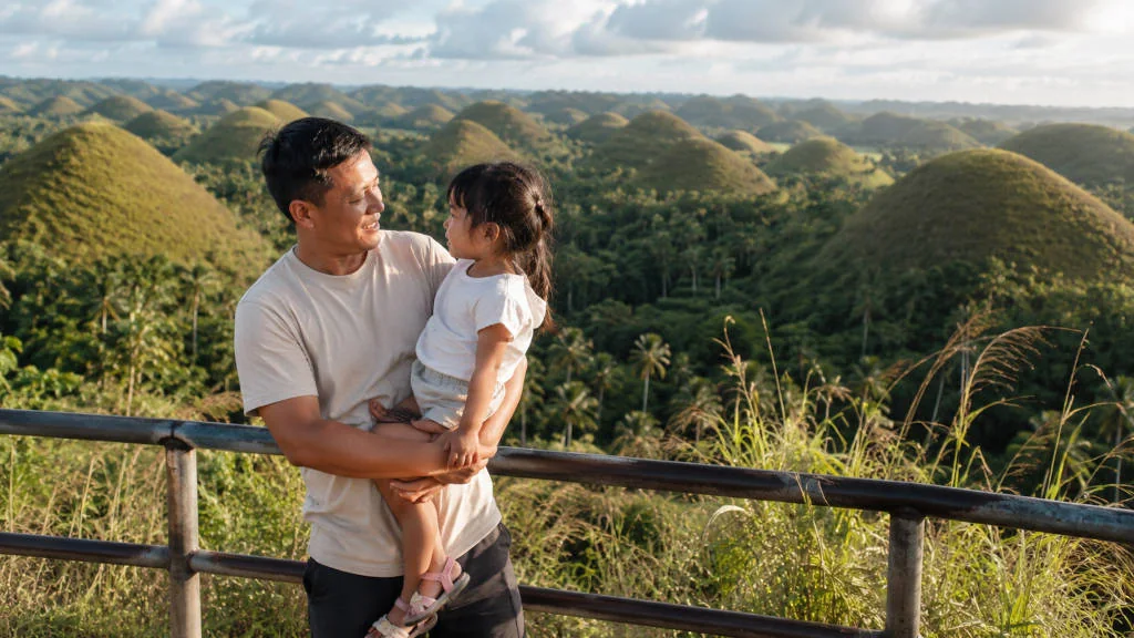 Family enjoying Bohol countryside with kids near Chocolate Hills
