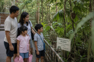 Family visiting a Bohol tarsier sanctuary during Bohol countryside with kids
