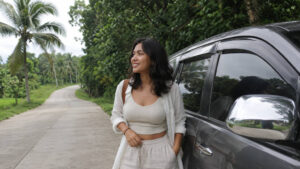 Mika smiling near a vehicle for how to get around Bohol countryside comfortably