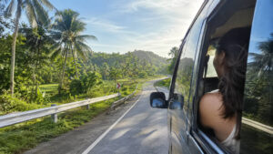 Private vehicle on a quiet road showing how to get around Bohol countryside comfortably