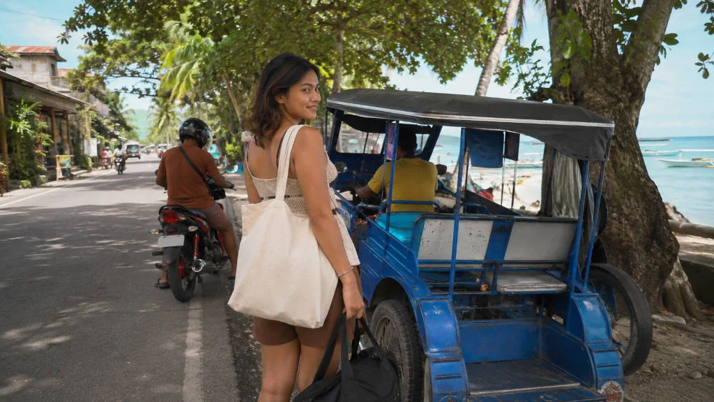Tricycle and motorbike options for how to get around Moalboal near the beach area