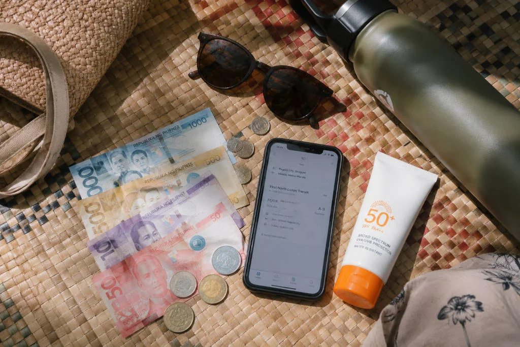 Cash and travel items for a La Union travel budget trip