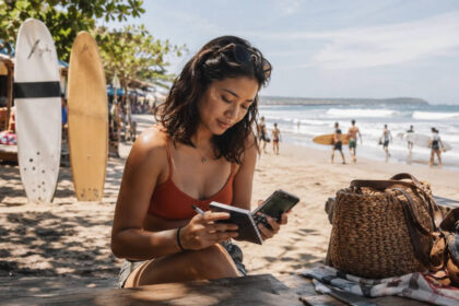 La Union travel budget planning near surfboards in San Juan
