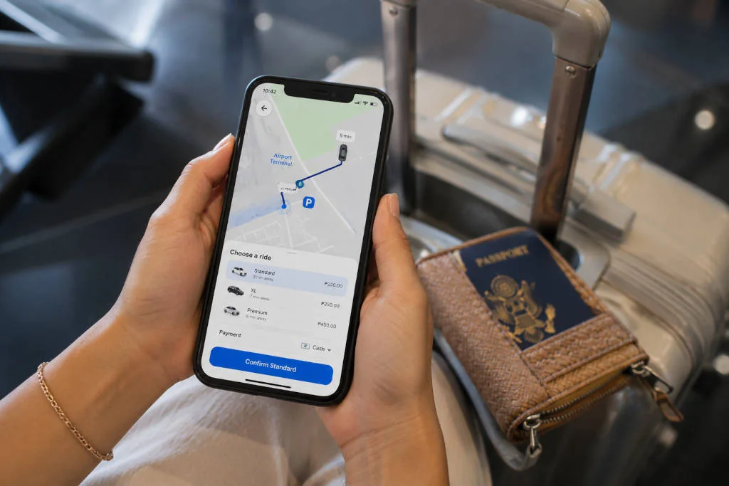 Phone prepared with pickup details for a mactan cebu airport to mactan resorts ride