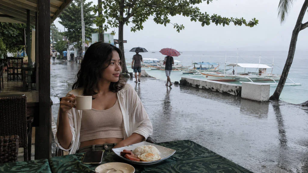 Moalboal rainy day near Panagsama Beach with travelers taking a slow food break